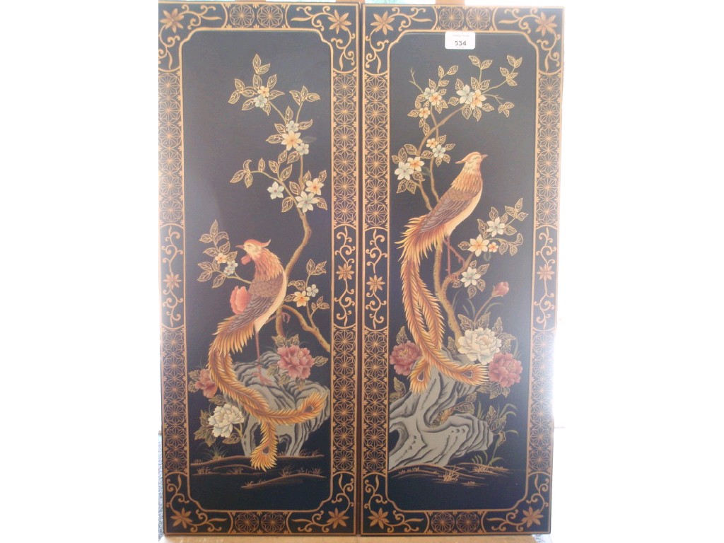 Appraisal: A pair of modern Chinese lacquer panels depicting birds and