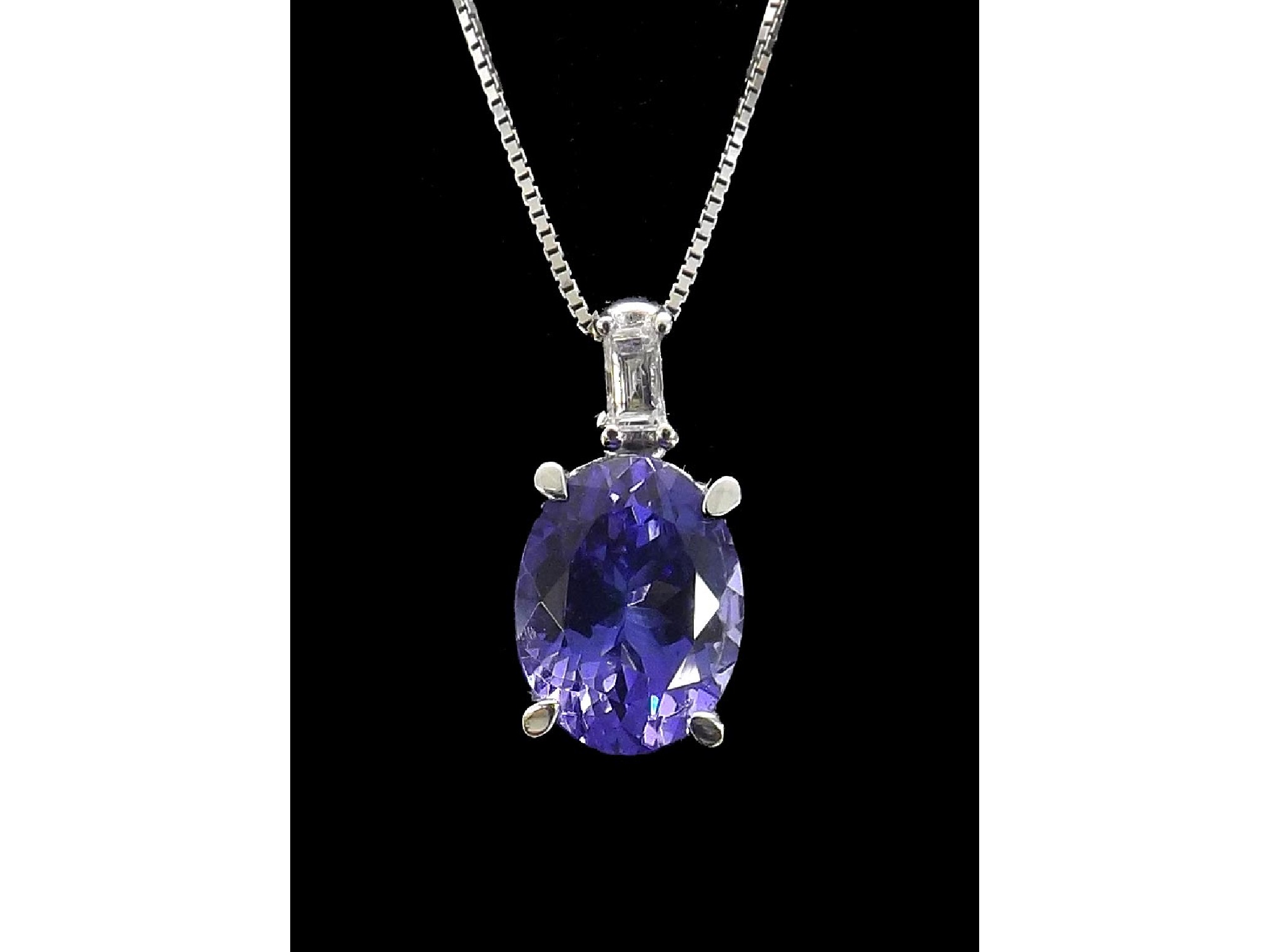 Appraisal: ct white gold tanzanite and diamond pendant on a slender