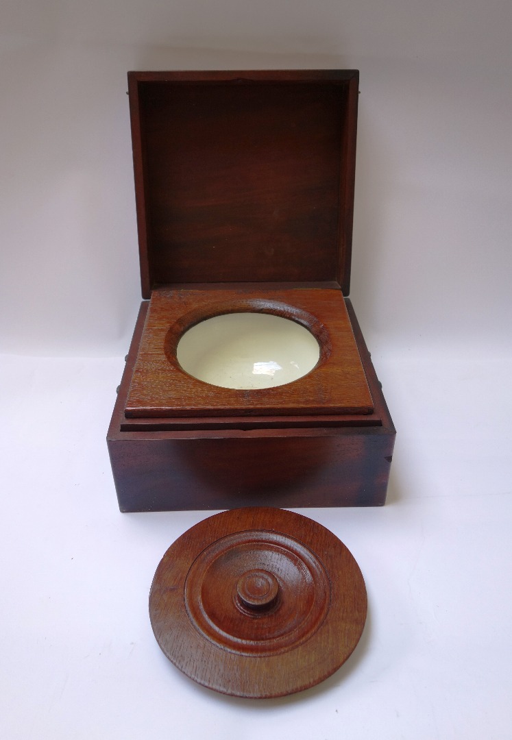 Appraisal: A George III mahogany travelling shaving bowl commode with lidded