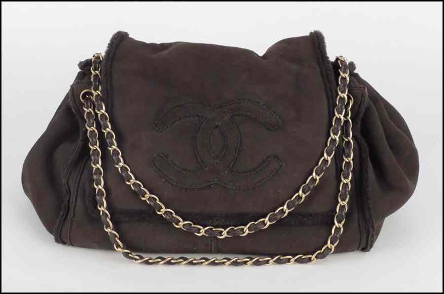 Appraisal: CHANEL BROWN SHEARLING HANDBAG With double chain strap and Chanel