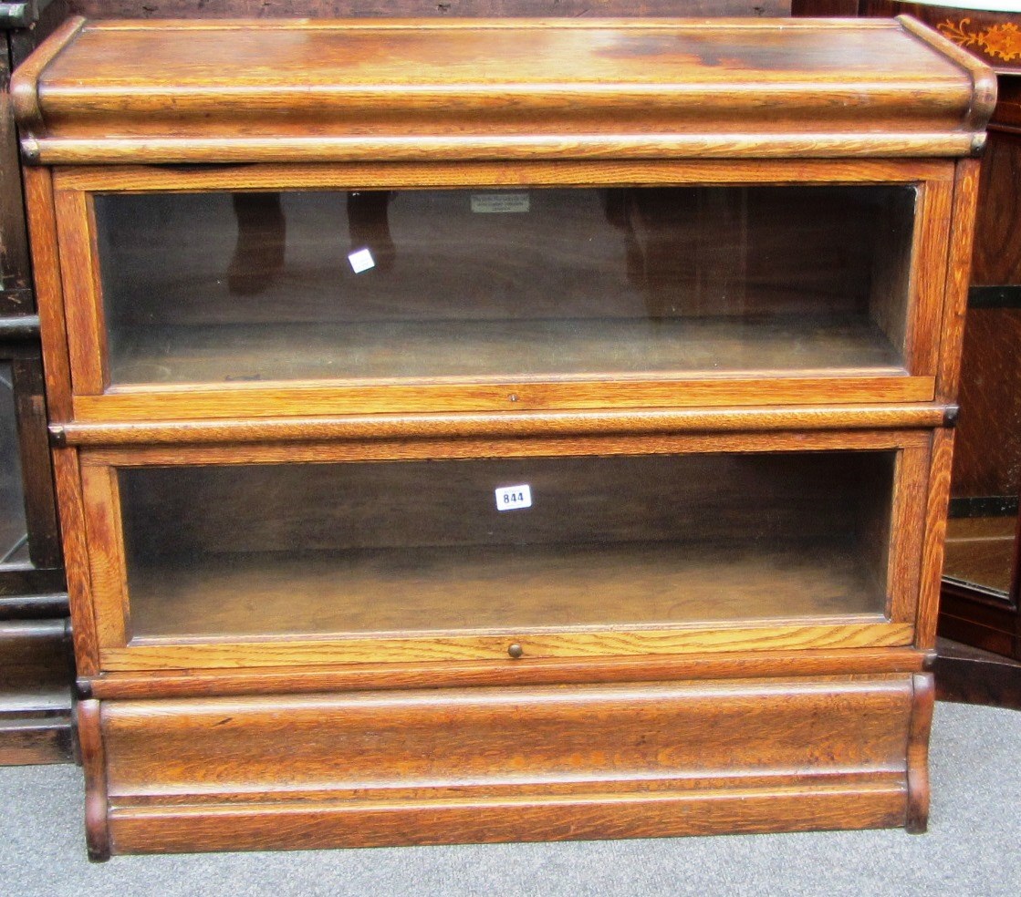 Appraisal: An oak Globe Wernicke two section book case cm wide