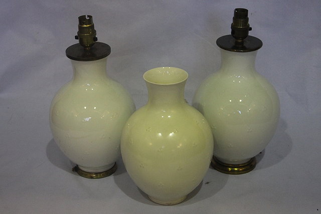 Appraisal: A PAIR OF BLANC DE CHINE PORCELAIN MOUNTED TABLE LAMPS