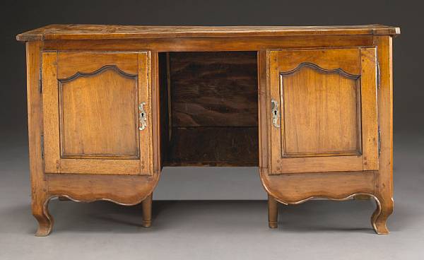 Appraisal: A Louis XV fruitwood kneehole desk second half th century