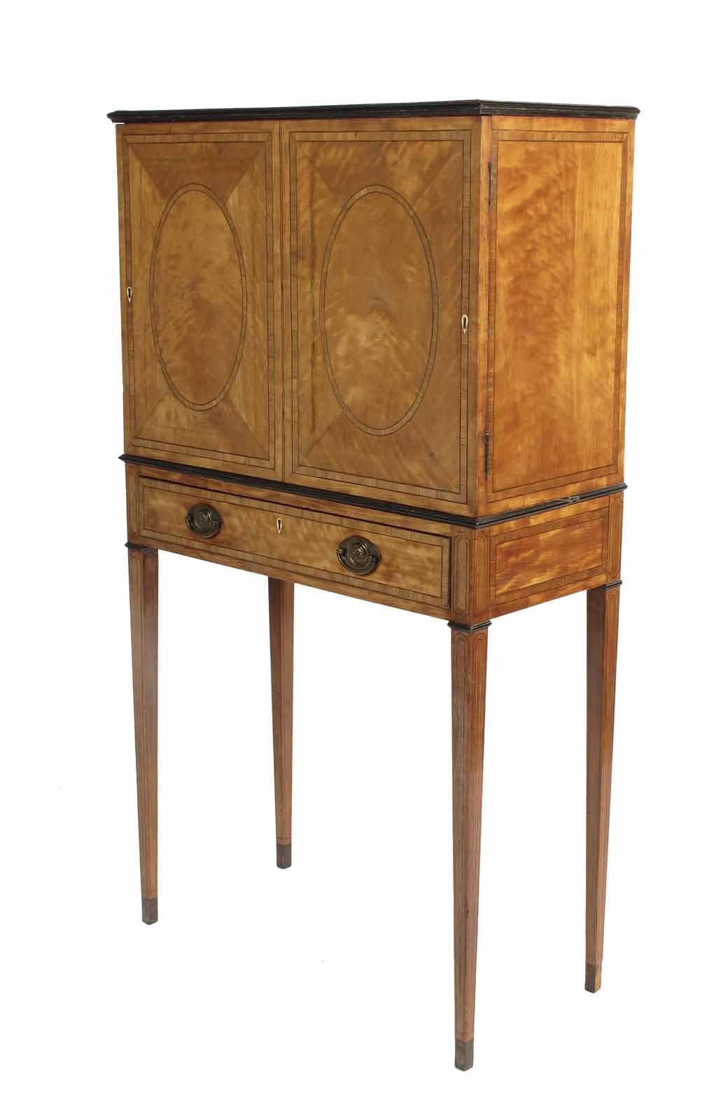 Appraisal: A satinwood cabinet on stand