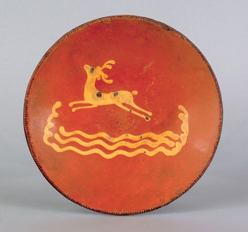 Appraisal: Pennsylvania redware charger th c with yellow slip decoration of