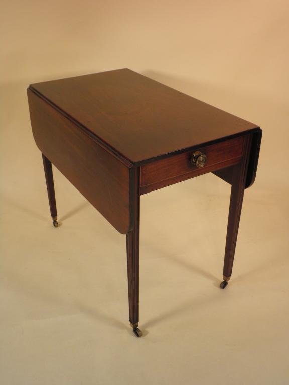 Appraisal: A George III mahogany pembroke table the rectangular top with