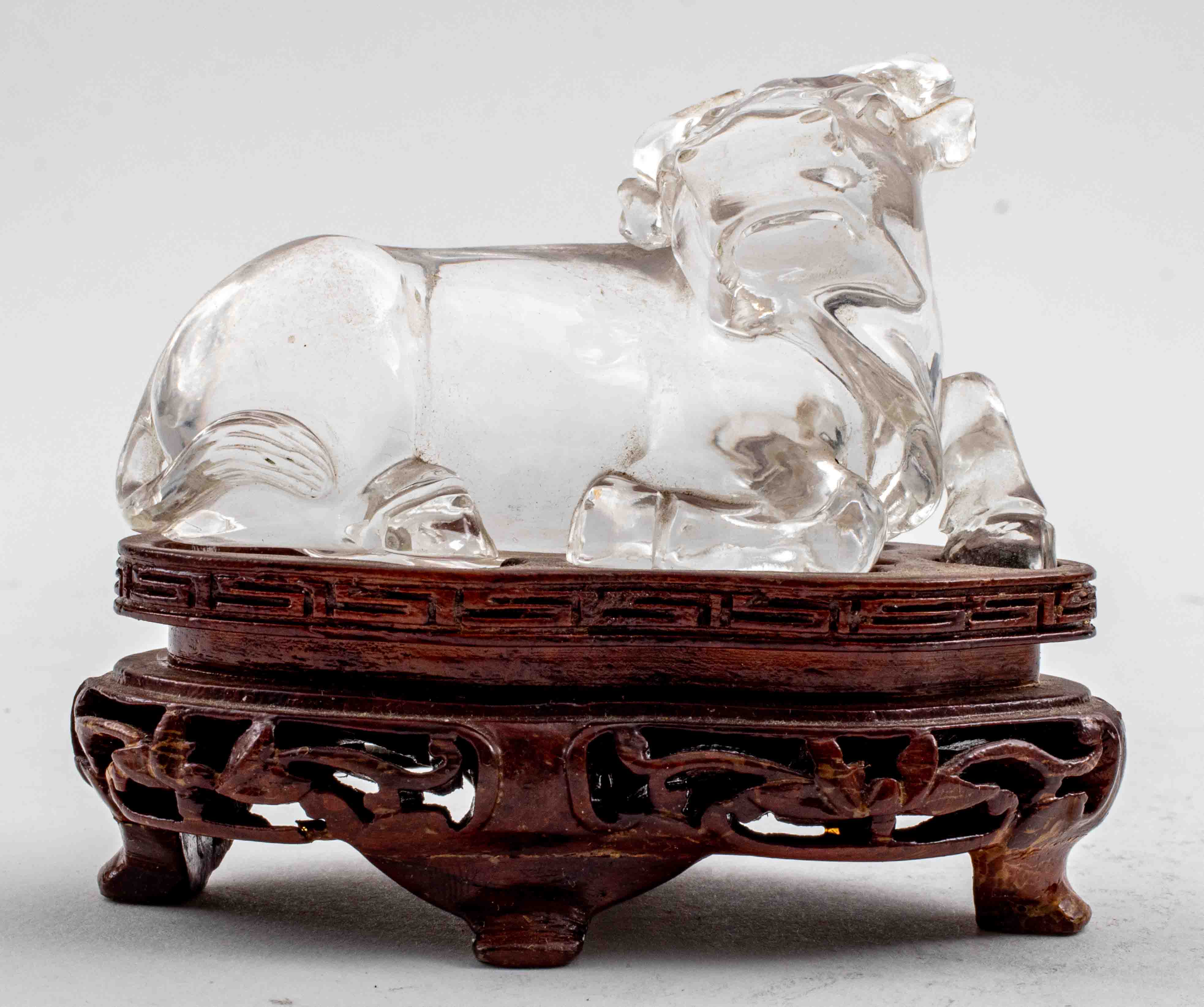 Appraisal: ASIAN ROCK CRYSTAL CARVING OF AN OX ON WOODEN STAND