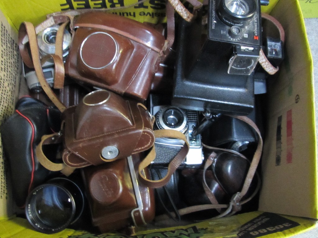 Appraisal: Lot comprising two boxes of cameras and accessories - Ziess