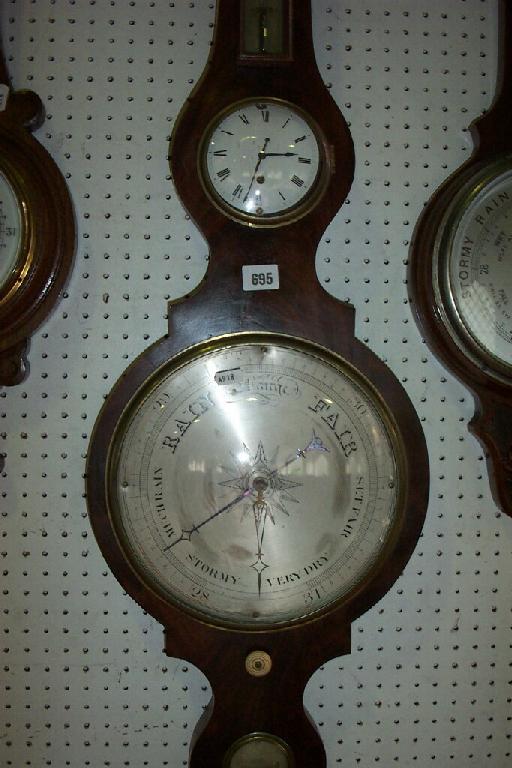 Appraisal: A Georgian mahogany wheel barometer with silvered dial and simple