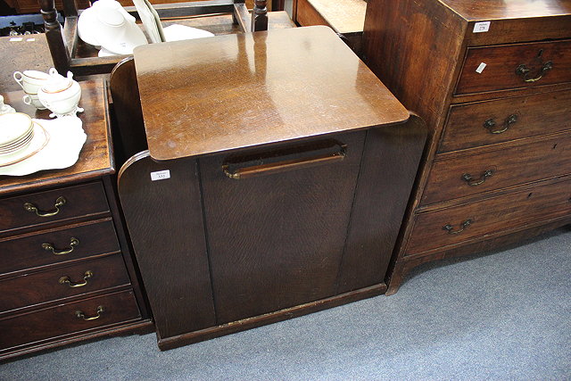 Appraisal: AN EARLY TH CENTURY OAK BOOKCASE CABINET with adjustable bookshelves