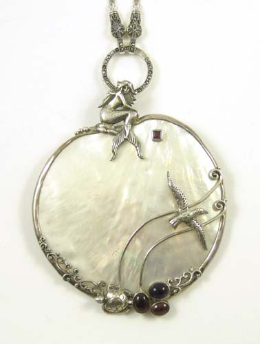 Appraisal: SHELL MERMAID PENDANT BROOCH NECKLACE having sterling silver mount with