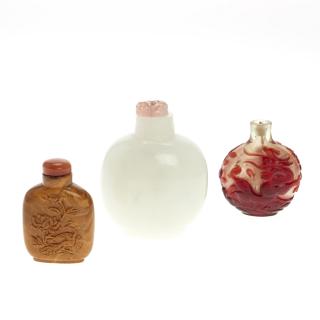 Appraisal: Chinese amber or Peking glass snuff bottles Chinese amber or