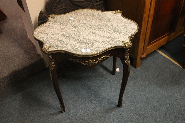 Appraisal: A FRENCH STYLE MARBLE TOP OCCASIONAL TABLE on cabriole supports