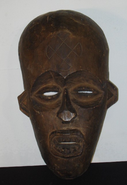 Appraisal: New Guinean Artefacts Two masks a contemporary carved figure and