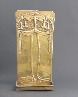 Appraisal: A large Scottish brass wall shelf hammered in relief with