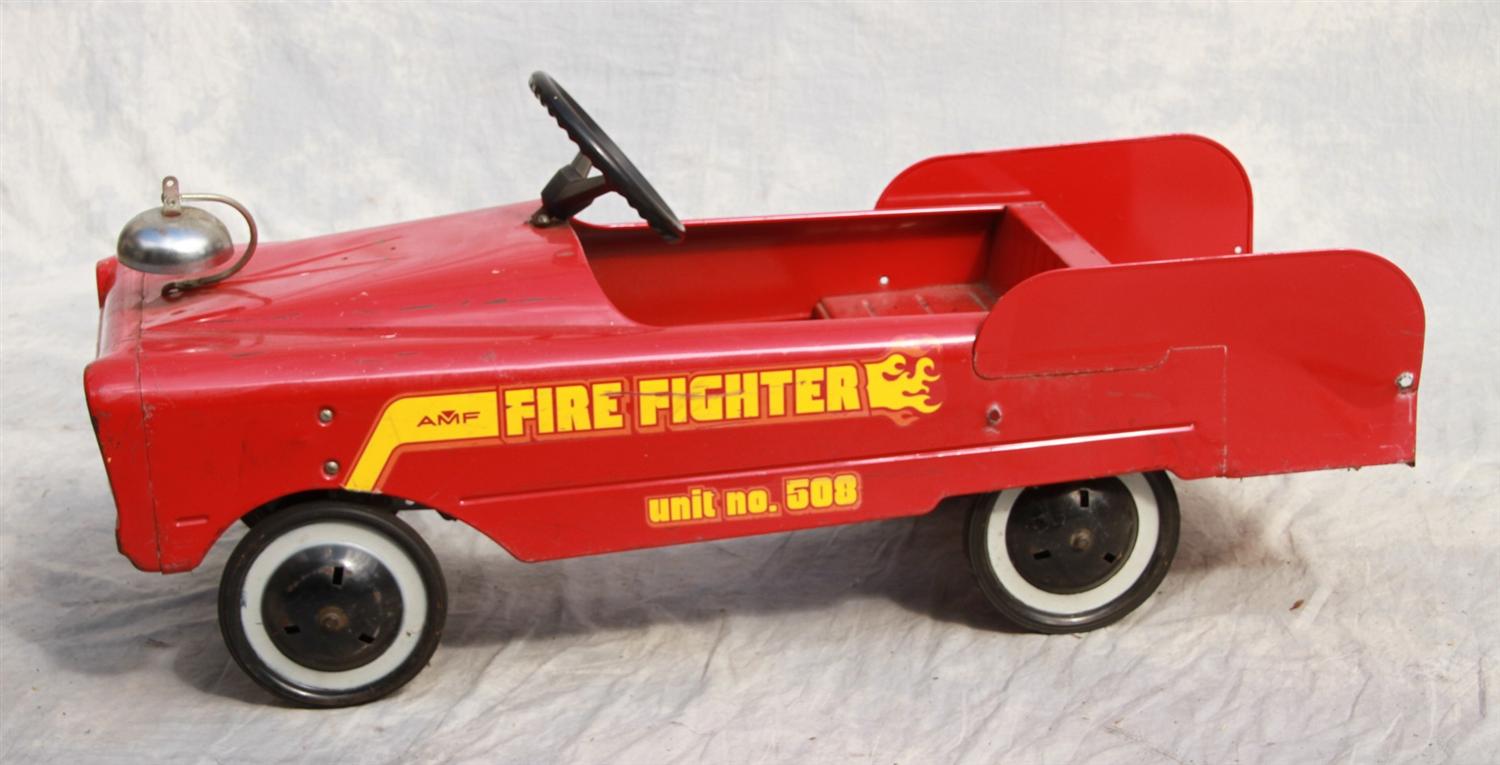 Appraisal: AMF firefighter unit pressed steel pedal car back railing missing