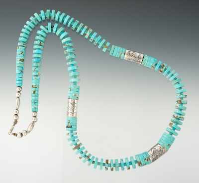 Appraisal: A Carved Turquoise and Sterling Silver Necklace Carved turquoise disks