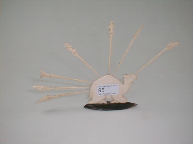 Appraisal: An bone cocktail stick holder in the form of a