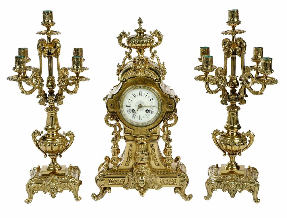 Appraisal: French Gilt Bronze Mantel Clock Garniture late th century circular