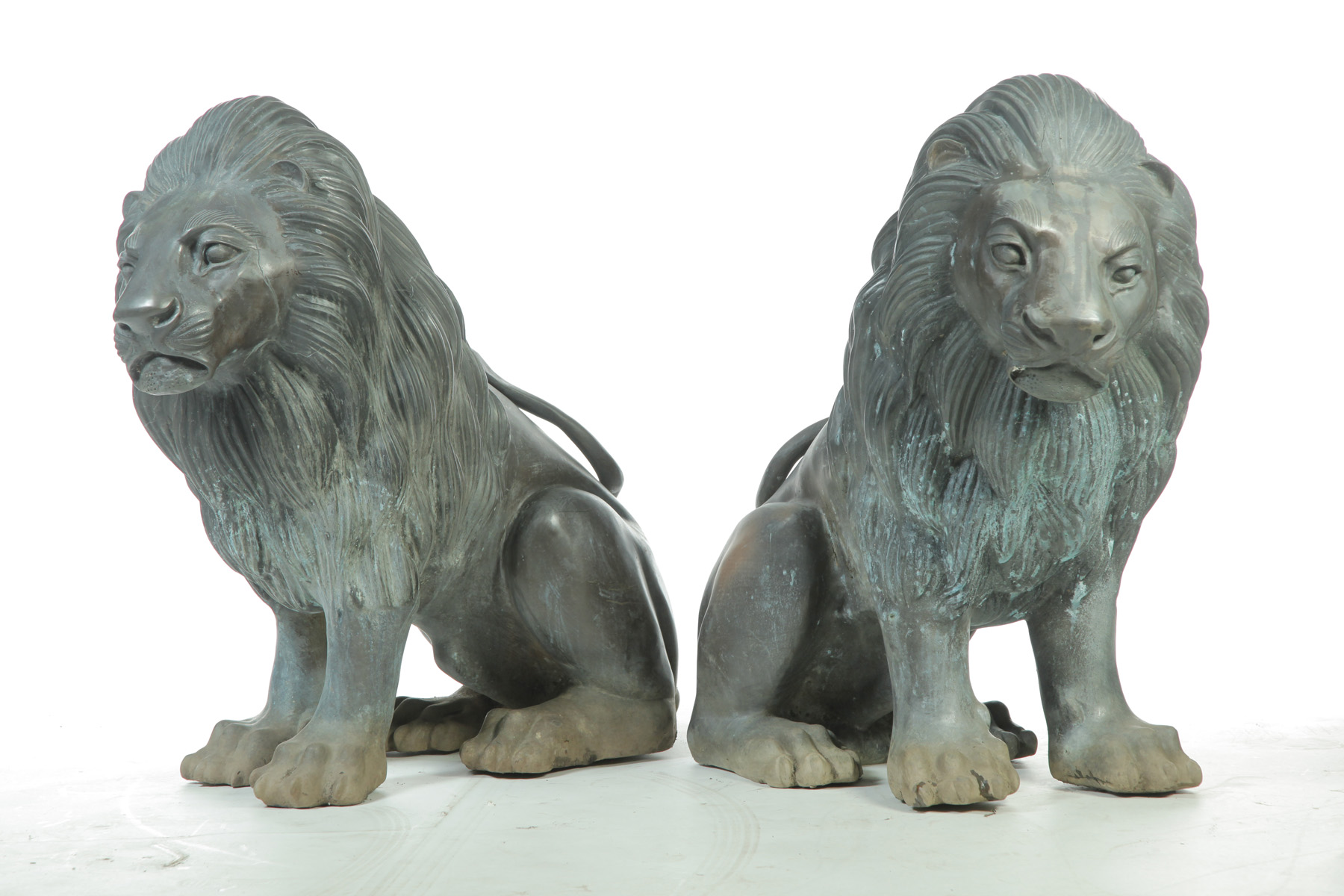 Appraisal: PAIR OF BRONZE SEATED LIONS Asian th quarter th century