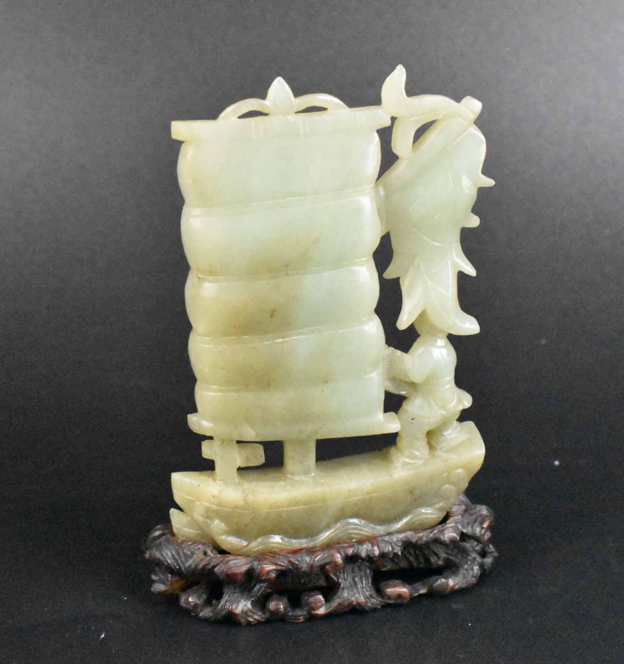 Appraisal: A Chinese jade carving of a sailing boat A Chinese