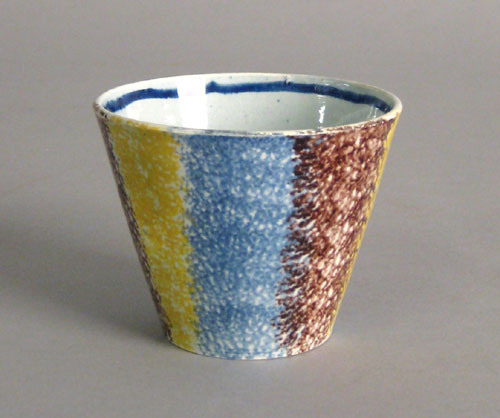 Appraisal: Yellow blue and brown rainbow spatter cup th c h