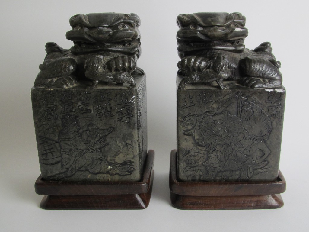 Appraisal: A pair of Chinese jadeite seals carved as buddhistic lions