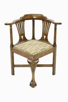 Appraisal: An th century walnut corner armchair with a pierced twin