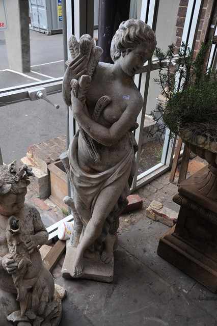 Appraisal: A LARGE CONCRETE STATUE DEPICITNG A FEMALE IN A CLASSICAL