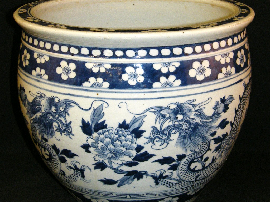 Appraisal: th century Chinese blue and white jardiniere decorated with bands