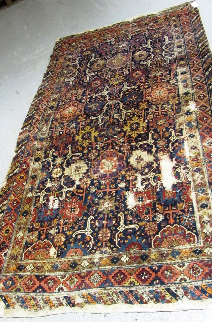 Appraisal: A kuba kelleh caucasian the indigo field with allover rosettes