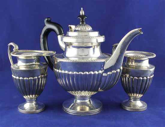 Appraisal: An Indian white metal three piece demi fluted tea set