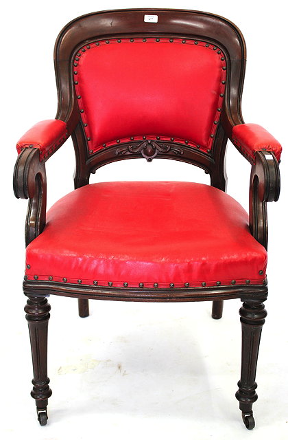 Appraisal: A VICTORIAN MAHOGANY FRAMED RED LEATHER UPHOLSTERED DESK CHAIR with