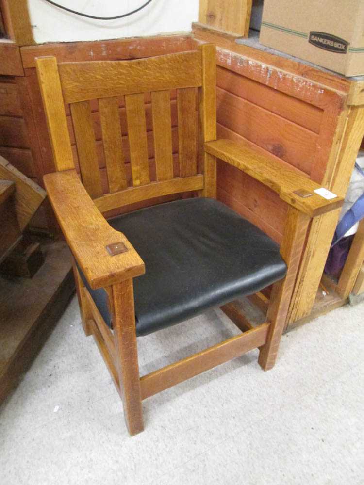 Appraisal: GUSTAV STICKLEY V-BACK OAK ARMCHAIR model - c five vertical