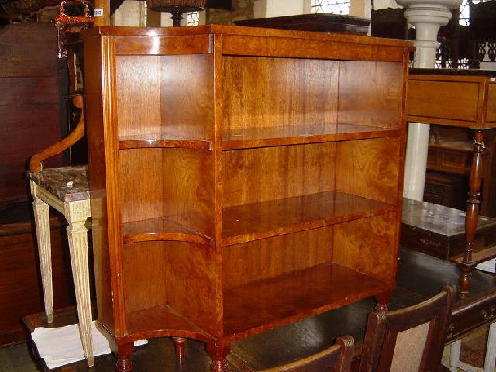 Appraisal: A reproduction free standing dwarf open bookcase figured and burr