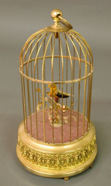 Appraisal: Automaton brass birdcage music box made in Germany and marked