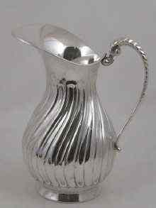 Appraisal: A large white metal tests silver water jug marked approx