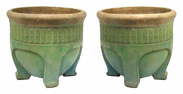 Appraisal: A pair of Arts and Crafts earthenware green glazed jardinieres