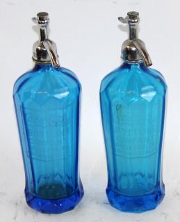 Appraisal: Pair of Coca Pair of blue glass Coca-Cola seltzer bottles