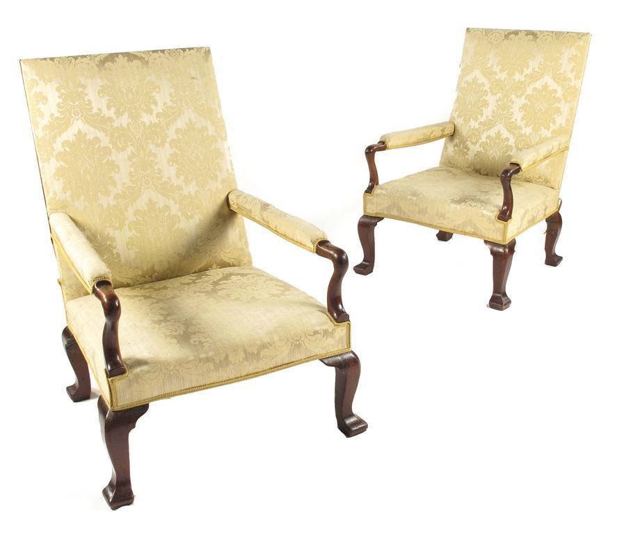 Appraisal: A pair of walnut library armchairs