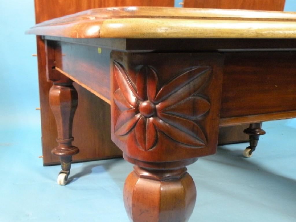 Appraisal: An early Victorian walnut extending dining table with two loose