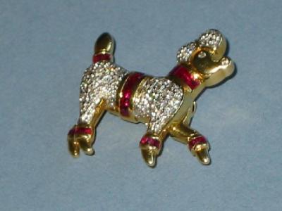 Appraisal: A RUBY AND DIAMOND POODLE BROOCH with pave set diamonds