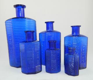 Appraisal: Poison cobalt irregular horizontal bottles Poison- cobalt irregular horizontal- plain