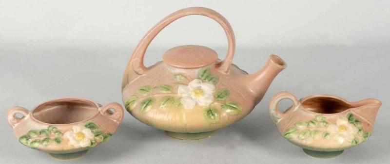 Appraisal: Roseville -Piece White Rose Teapot Set Description Teapot handle has