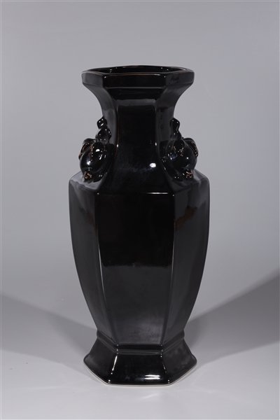 Appraisal: Chinese black glazed porcelain faceted vase with peach handles overall