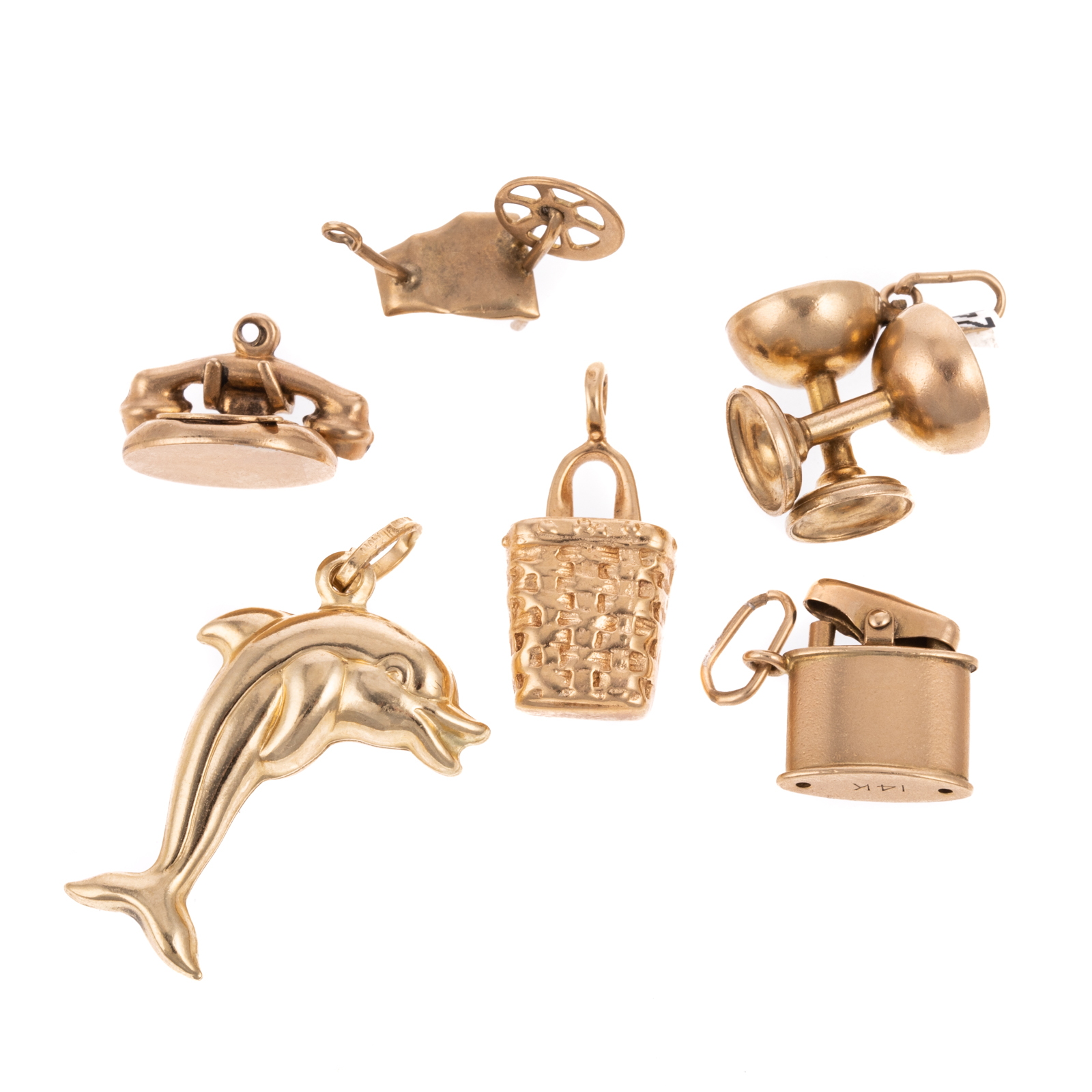 Appraisal: AN ASSORTMENT OF WHIMSICAL CHARMS IN GOLD Assortment of gold