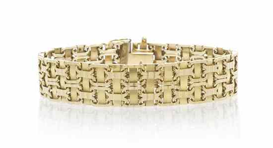 Appraisal: A Karat Yellow Gold Textured Woven Bracelet consisting of an