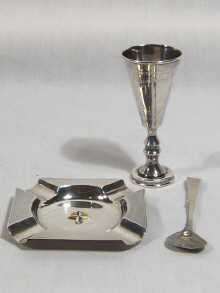 Appraisal: A silver ashtray with engine turned decoration and enamelled Festival