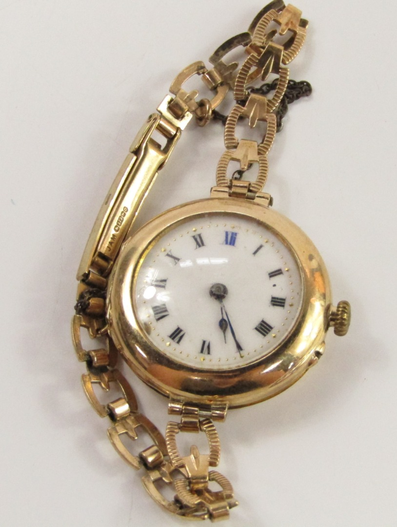 Appraisal: A lady's ct gold circular cased wristwatch white enamel dial