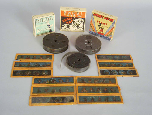 Appraisal: Early projector together with a magic lantern three cartoon reels